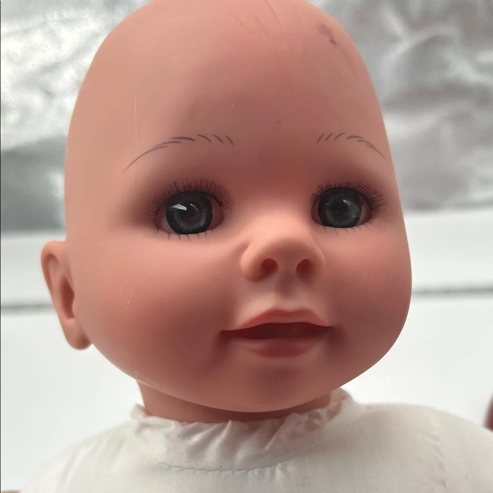 Realistic Baby Doll with White Outfit